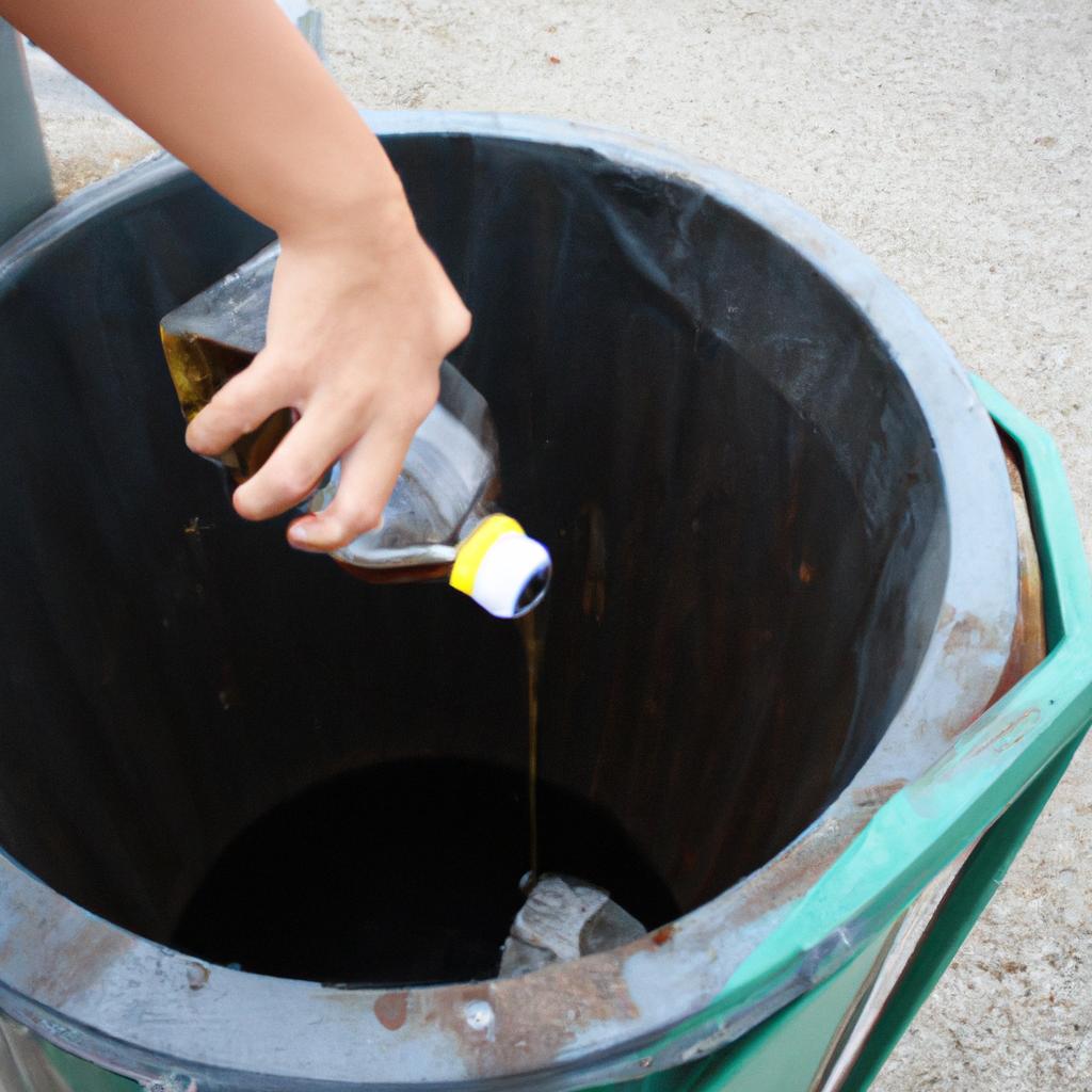 Person pouring liquid into bin